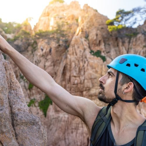 young-male-climber-strong-success-hiking-on-rocks-2024-01-23-00-22-27-utc.jpg